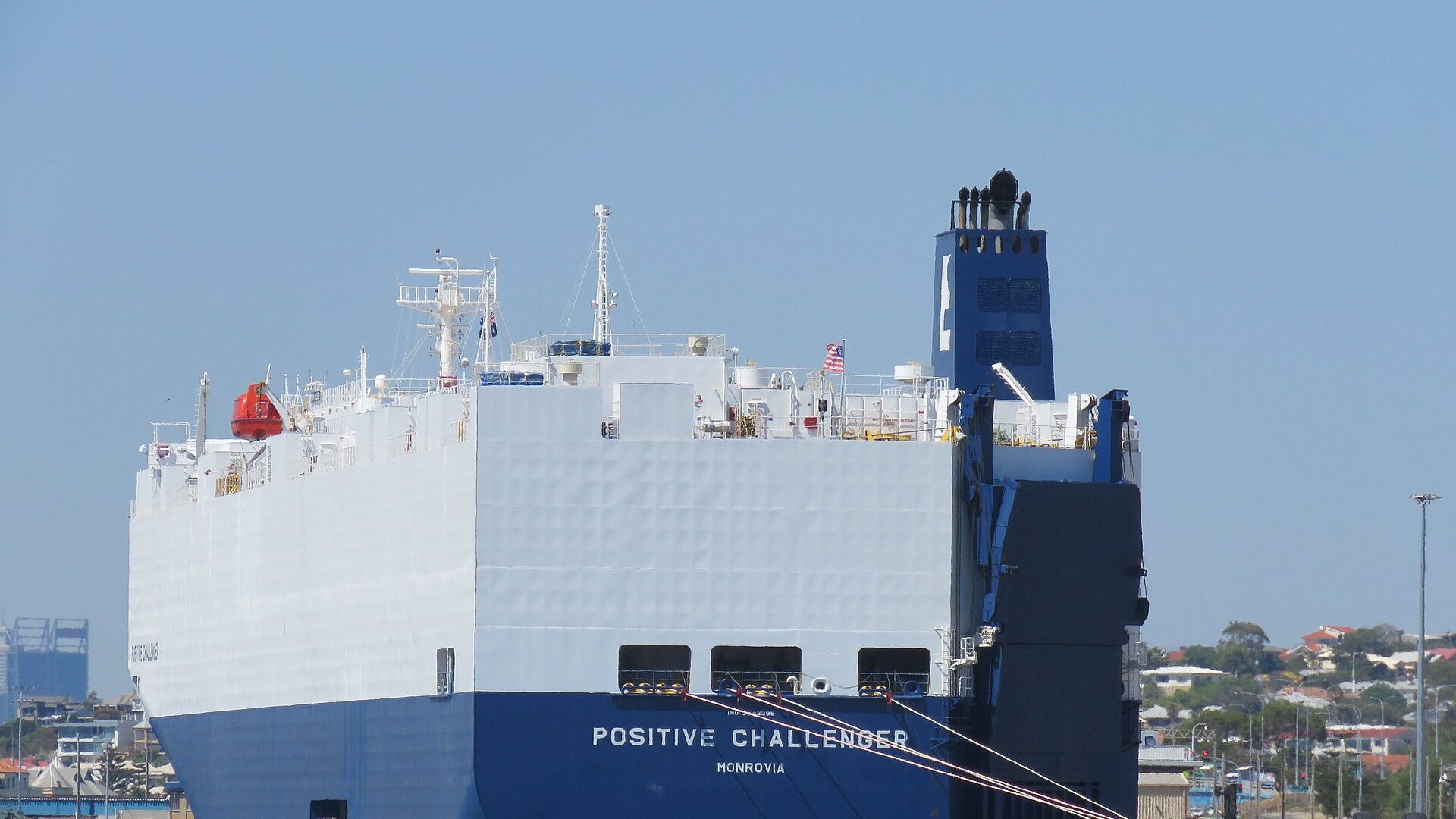 Vehicle carrier ship discharging imported vehicles at port